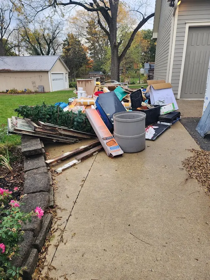 Dumpster being loaded with debris for Residential Dumpster Rental in Niwot